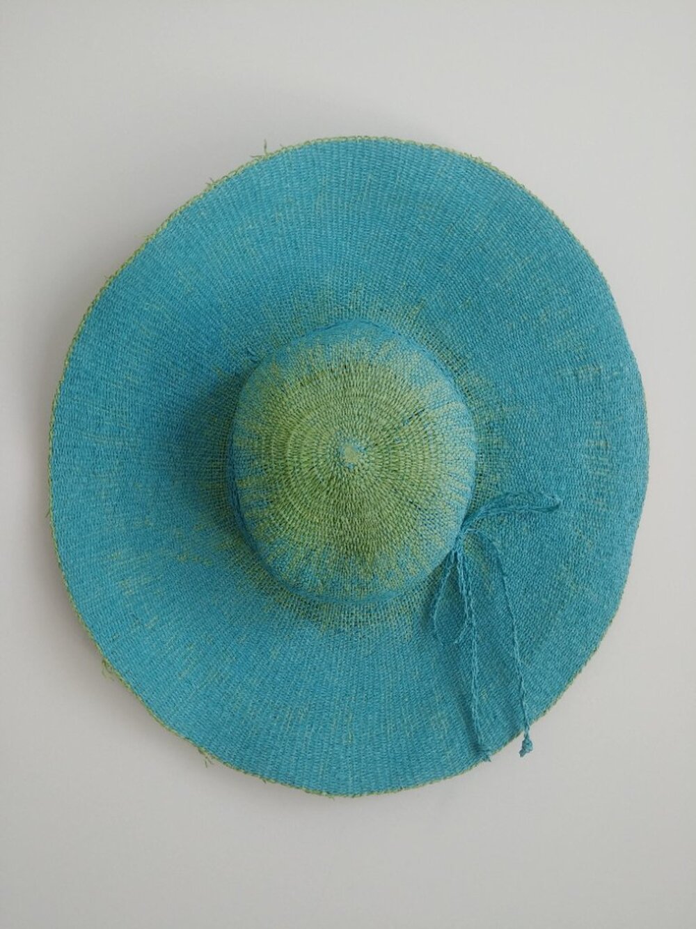 100% paper straw hat bright blue with green trim